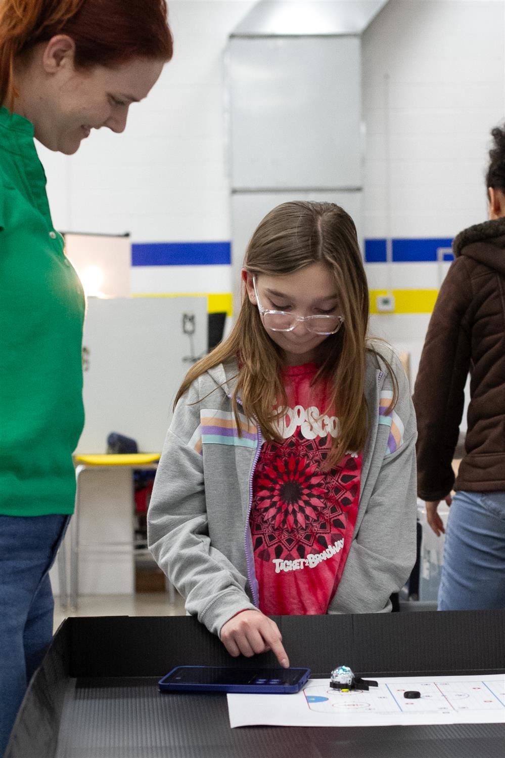 Student uses coding robotics activity at STEM Open House event Student uses coding robotics activity at STEM Open House event