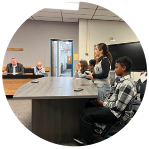 Middle school student presents to school board