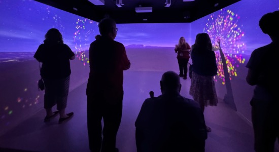  Group uses the interactive elements of the immersive reality room