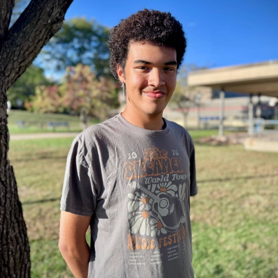  William Wilson smiling in front of a tree